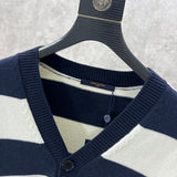 Close-up detail shot of Louis Vuitton luxury clothing with label-forward styling