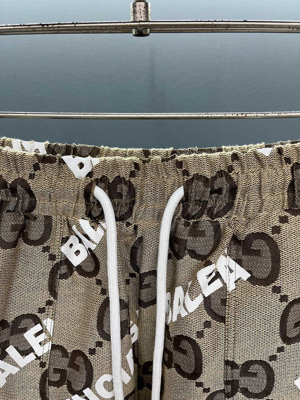Close-up detail shot of Gucci luxury clothing with monogram-inspired silhouette