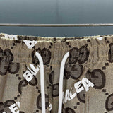Close-up detail shot of Gucci luxury clothing with monogram-inspired silhouette