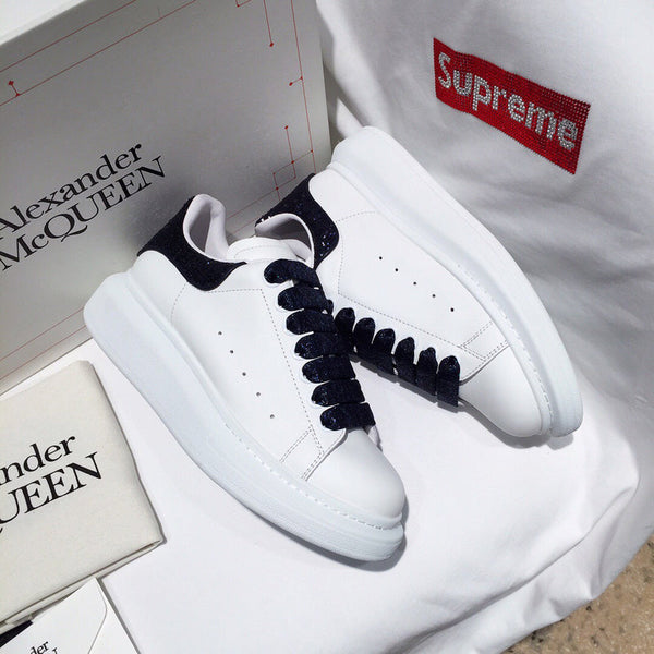 Alexander McQueen Designer sneakers in crisp white cushioned comfort fit front view