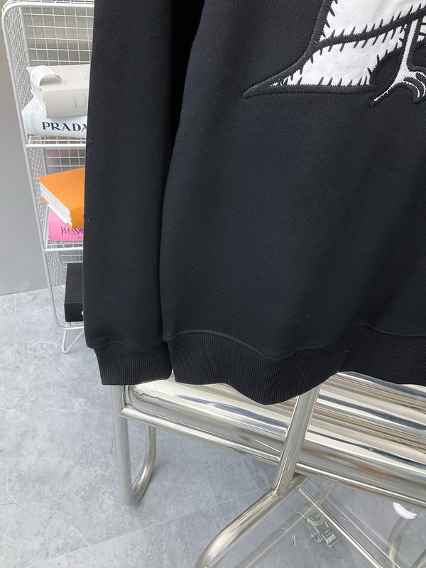 Flat lay presentation of Louis Vuitton luxury clothing with streetwear-inspired cut