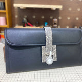 Side view of fluid structured handbag