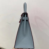 Side view of minimalist structured handbag