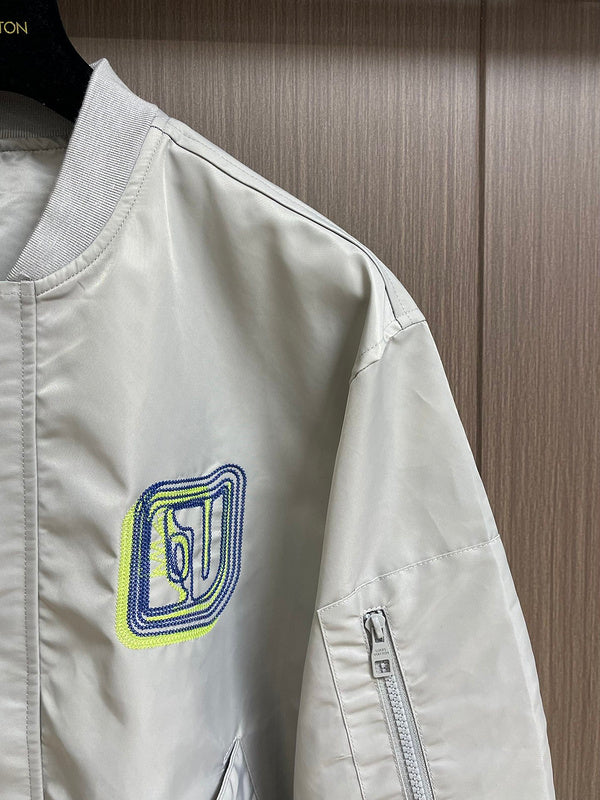 Full styled look of Louis Vuitton luxury clothing with label-forward styling