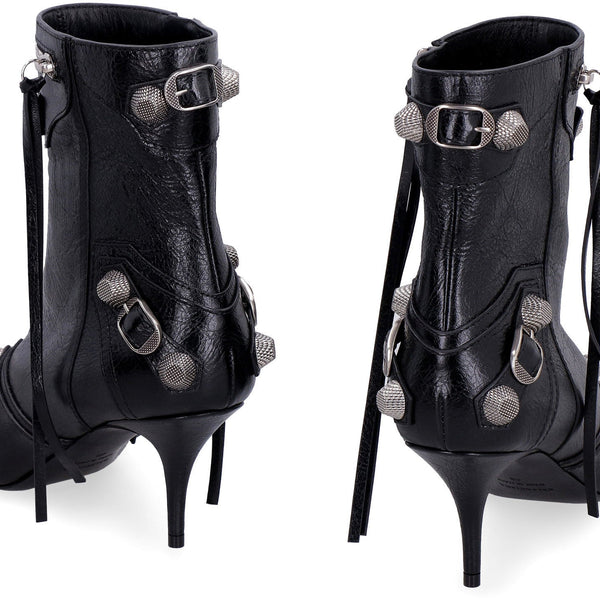 Close-up of Balenciaga boots hardware and fine stitching