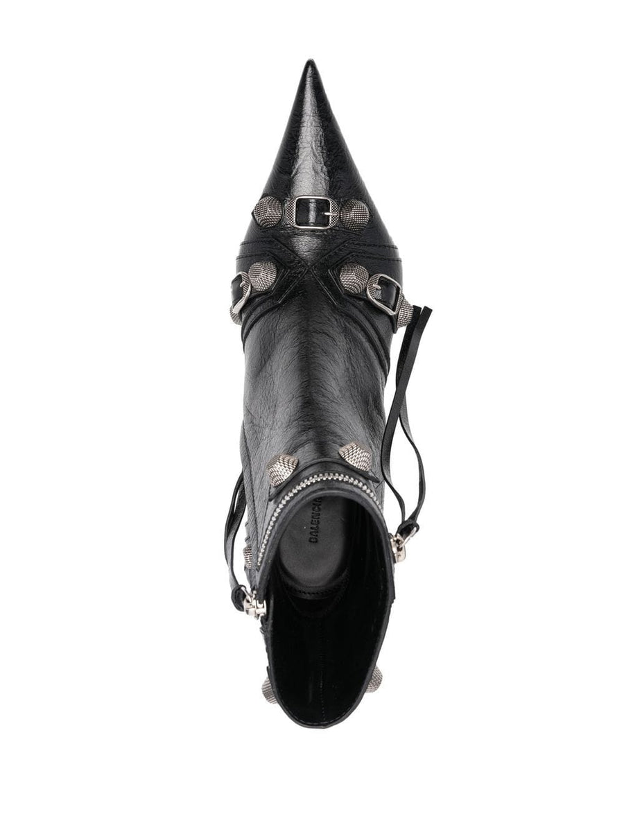 Close-up of Balenciaga boots hardware and fine stitching