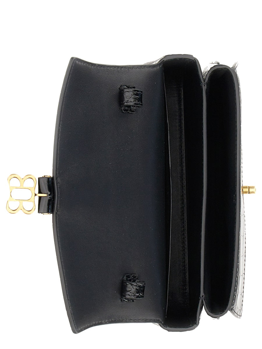 Close-up of Balenciaga crossbody hardware and fine stitching