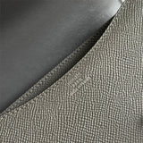 Side view of poised structured handbag
