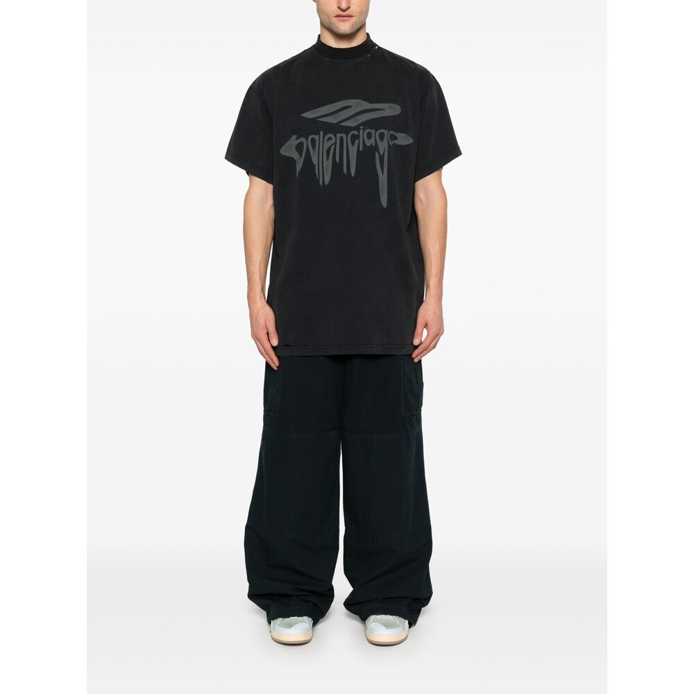 Close-up of Balenciaga pants hardware and fine stitching