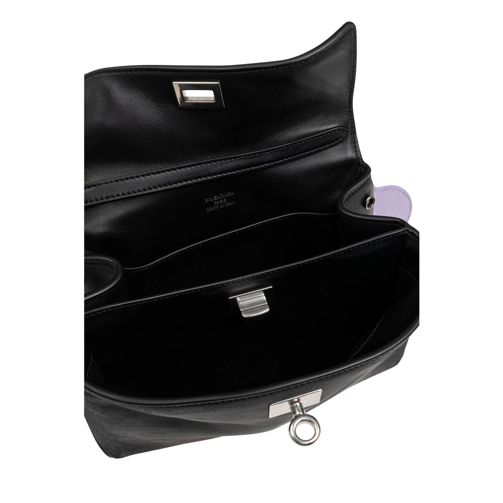 Close-up of Balenciaga totes hardware and fine stitching