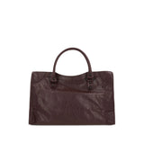 Close-up of Balenciaga totes hardware and fine stitching