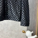 Back view of Louis Vuitton luxury clothing with label-forward styling