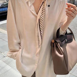 Side view of sculpted structured handbag