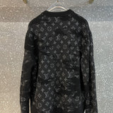 Back view of Louis Vuitton luxury clothing with label-forward styling
