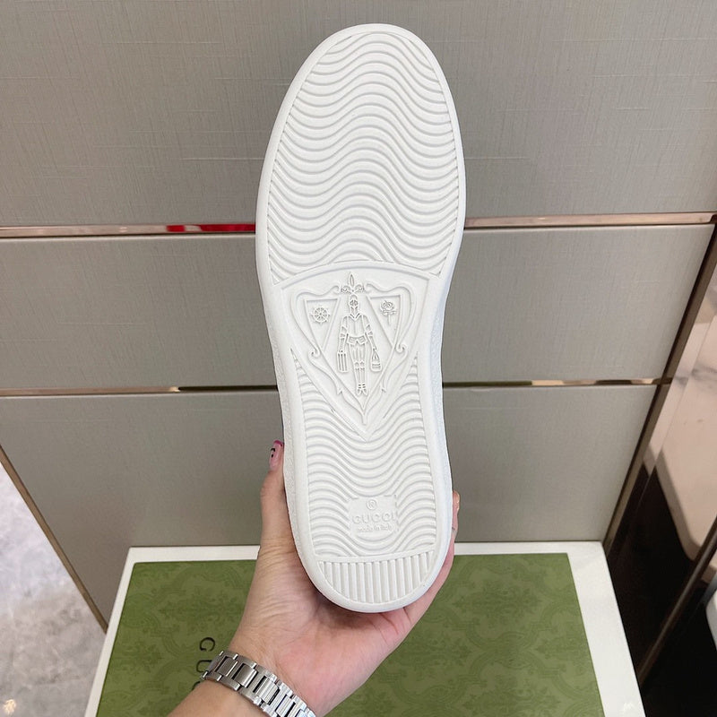 Side profile of Gucci neutral cream sneakers sleek tonal finish