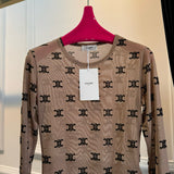 Front view of Celine premium Bodysuit with iconic logo hardware