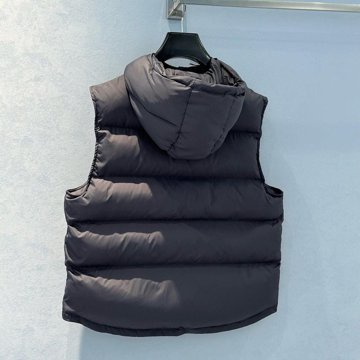 Front view of Celine premium Vest with iconic logo hardware