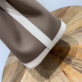 Close-up detail of graceful bag design
