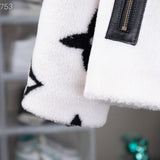 Side profile of Louis Vuitton luxury clothing with signature branding