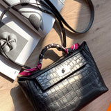 Side view of contemporary structured handbag