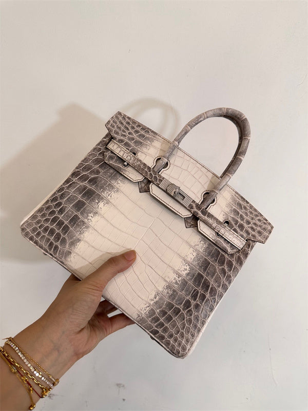  Statement crossbody bag carried on shoulder