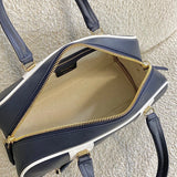 Handle and strap detail of modern polished women's handbag – women's luxury handbag