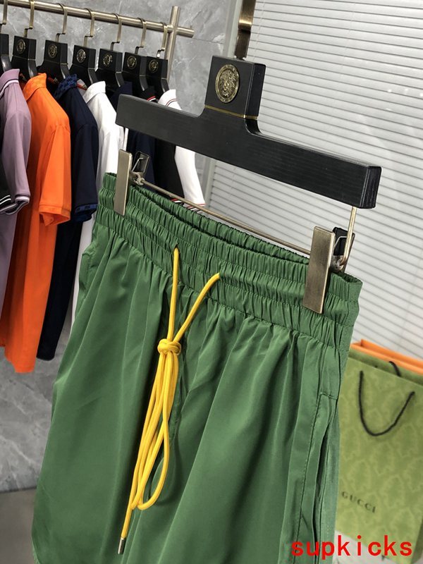 Flat lay presentation of Rhude luxury clothing with label-forward styling
