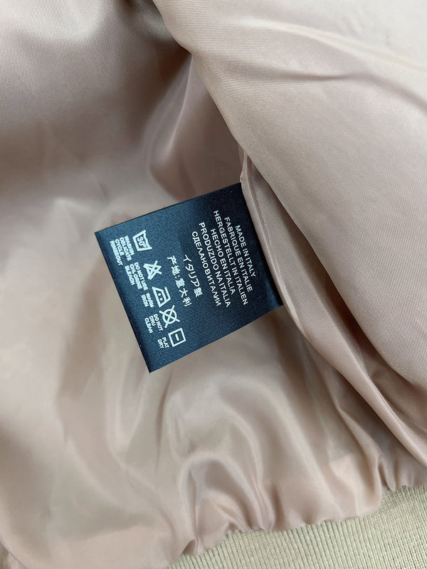 Close-up detail shot of Gucci luxury clothing with monogram-inspired silhouette
