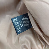 Close-up detail shot of Gucci luxury clothing with monogram-inspired silhouette