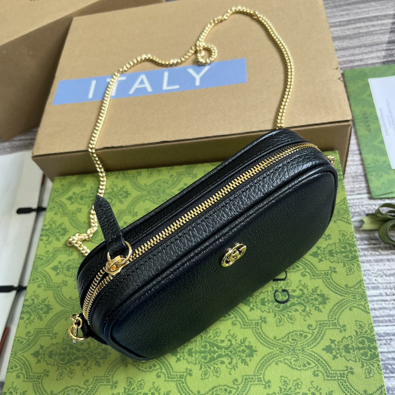 Styled lifestyle shot of structured classic women's handbag – women's luxury handbag