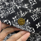 Front view of Louis Vuitton luxury clothing with label-forward styling