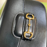Close-up detail of structured signature women's handbag – women's luxury accessory