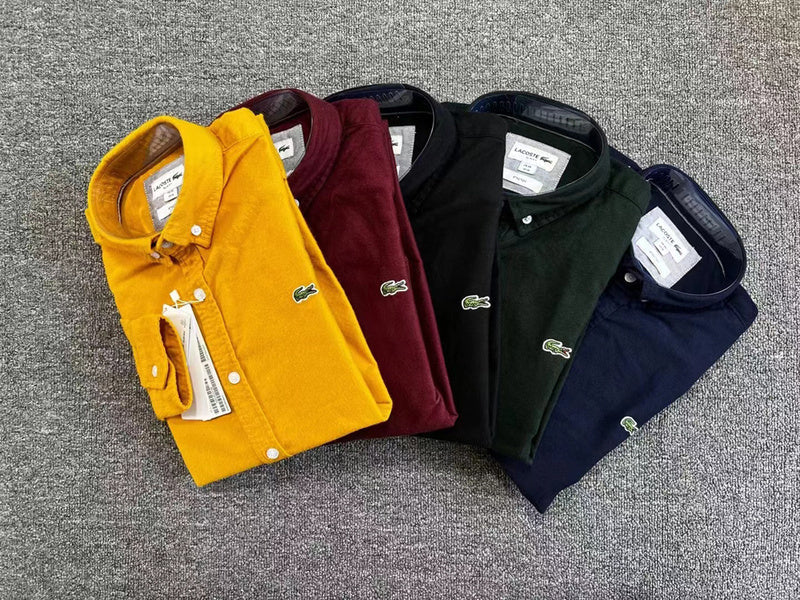 Flat lay presentation of Lacoste luxury clothing with logo-detail design