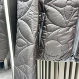 Flat lay presentation of Louis Vuitton luxury clothing with logo-detail design