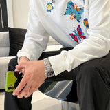 Flat lay presentation of Louis Vuitton luxury clothing with contemporary cut