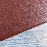 Styled lifestyle shot of signature chic women's handbag – women's luxury accessory