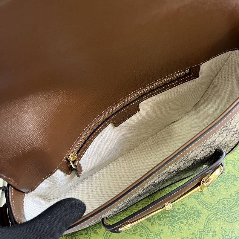 Close-up detail of structured polished women's handbag – women's designer-style accessory