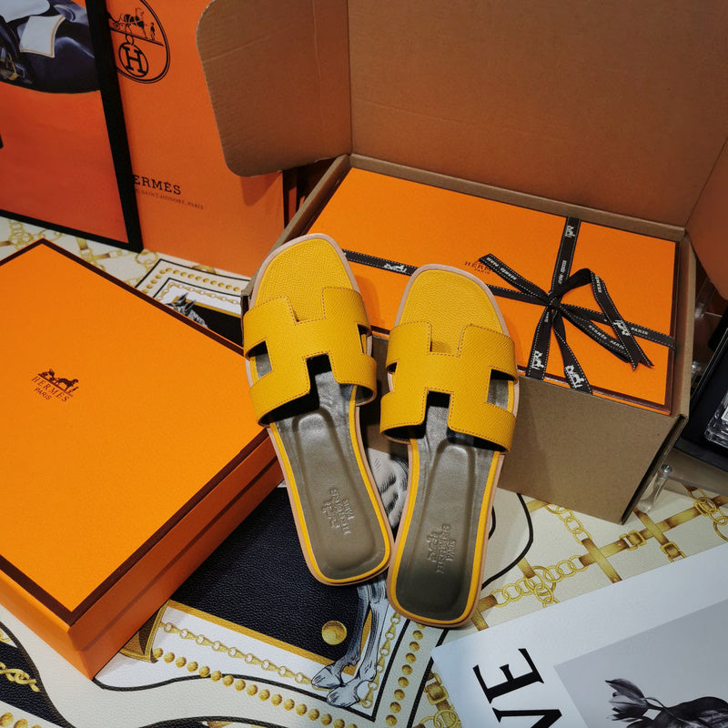 Hermes sandals Style 091 - close-up of classic monogram styling