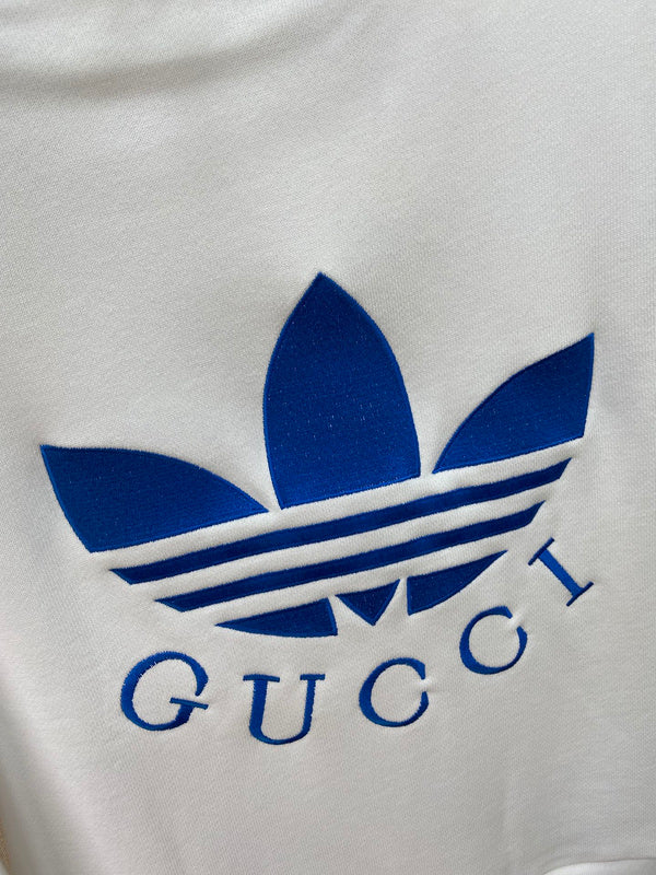 Close-up detail shot of Gucci luxury clothing with logo-detail design