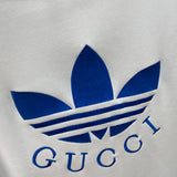 Close-up detail shot of Gucci luxury clothing with logo-detail design