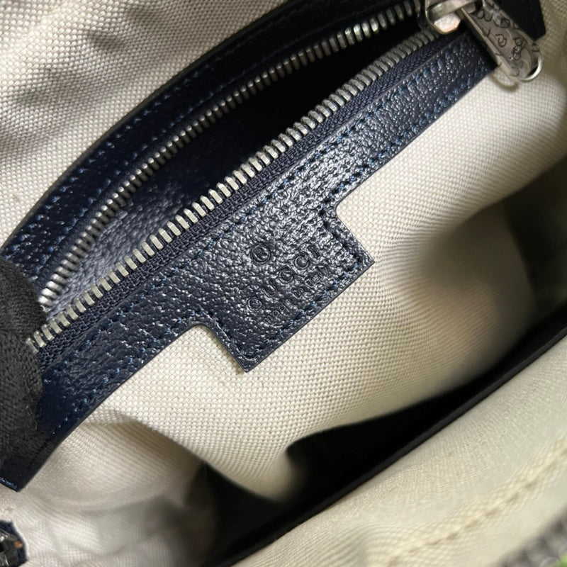 Close-up detail of signature premium women's handbag – women's statement bag