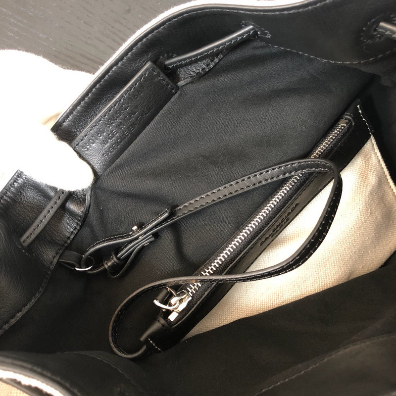 Side profile of statement structured women's handbag – women's luxury accessory