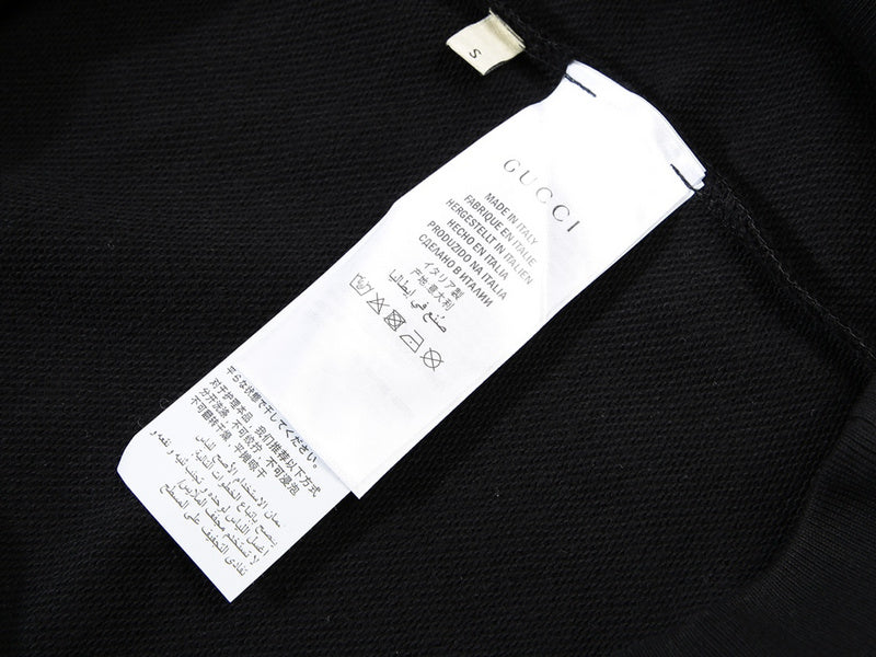 Close-up detail shot of Gucci luxury clothing with streetwear-inspired cut