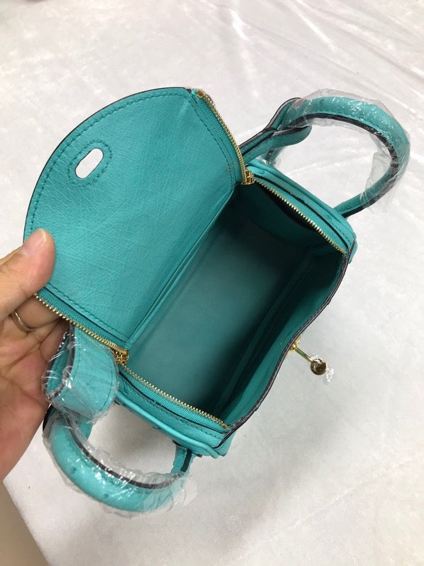 Side view of curated structured handbag