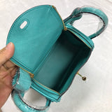 Side view of curated structured handbag