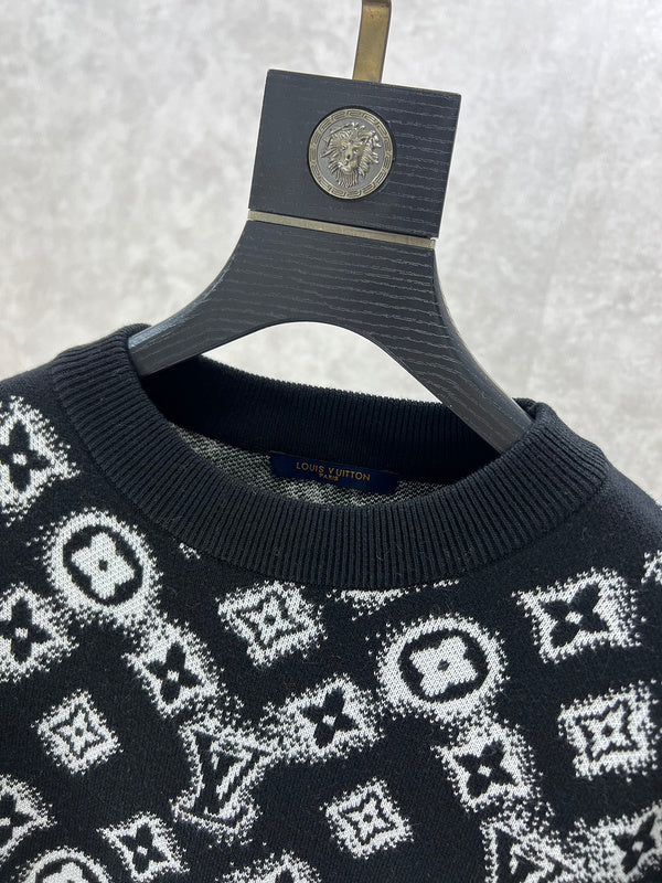 Close-up detail shot of Louis Vuitton luxury clothing with logo-detail design
