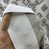 Back view of Louis Vuitton luxury clothing with logo-detail design