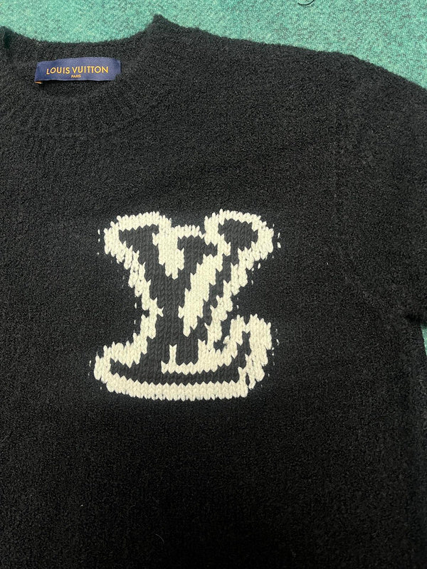 Full styled look of Louis Vuitton luxury clothing with label-forward styling