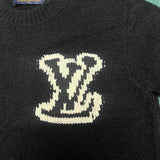 Full styled look of Louis Vuitton luxury clothing with label-forward styling