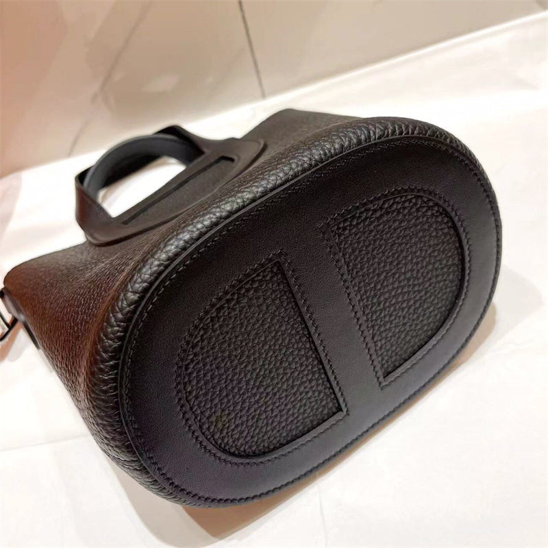 Side view of poised structured handbag